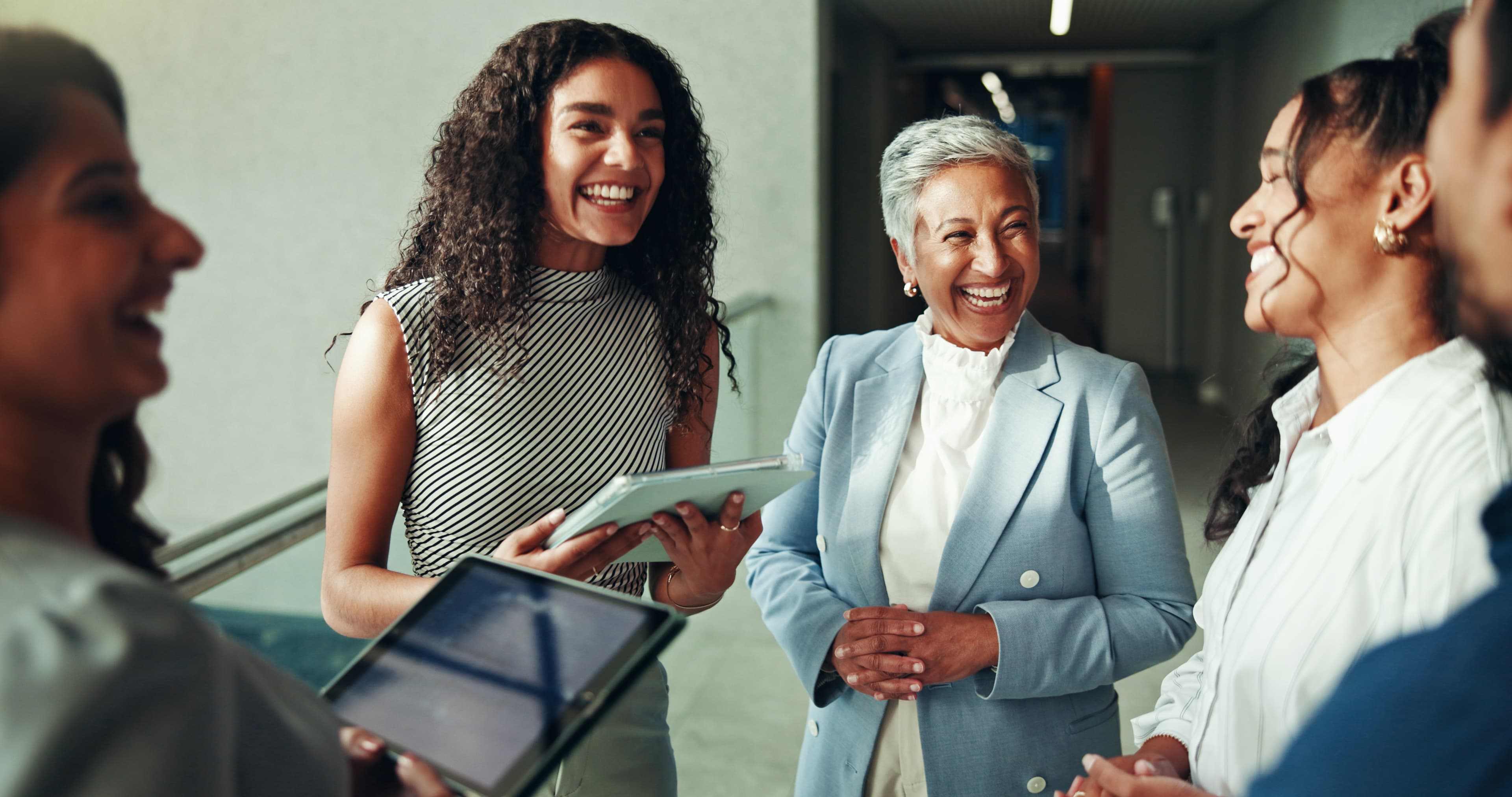 Professional women laughing and connecting together